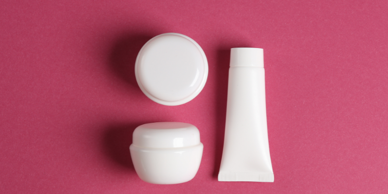 Collection of cosmetic creams, jars, and skincare products for custom formulation in Abu Dhabi.